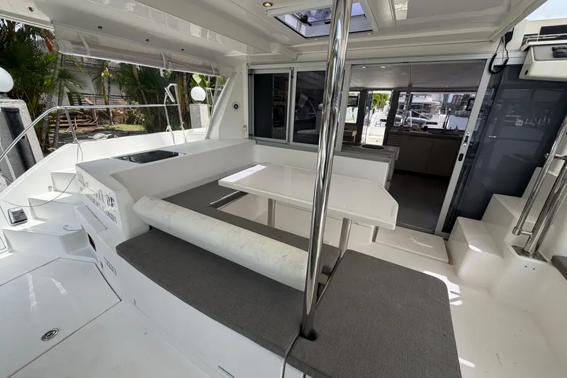 Slide: The Image of Spacious deck area of a 2018 Leopard 40 catamaran with seating and table. - 48