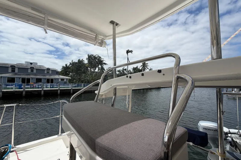 Slide: The Image of Leopard 40 catamaran deck view with waterfront and palm trees, 2018 model. - 50