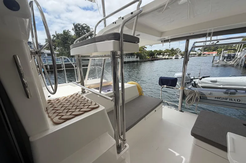 Slide: The Image of 2018 Leopard 40 catamaran interior with seating, helm, and water view. - 53