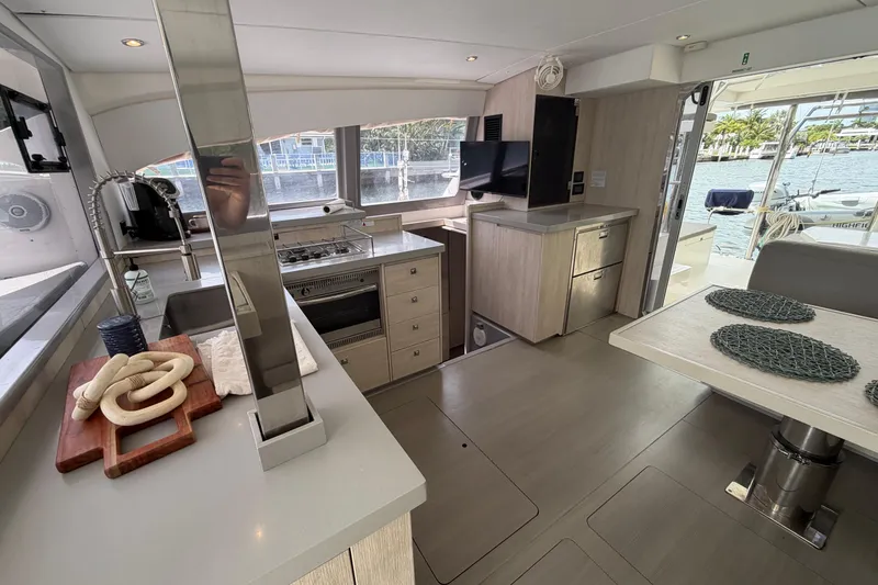 Slide: The Image of Modern interior of a 2018 Leopard 40 catamaran with kitchen and dining area. - 55