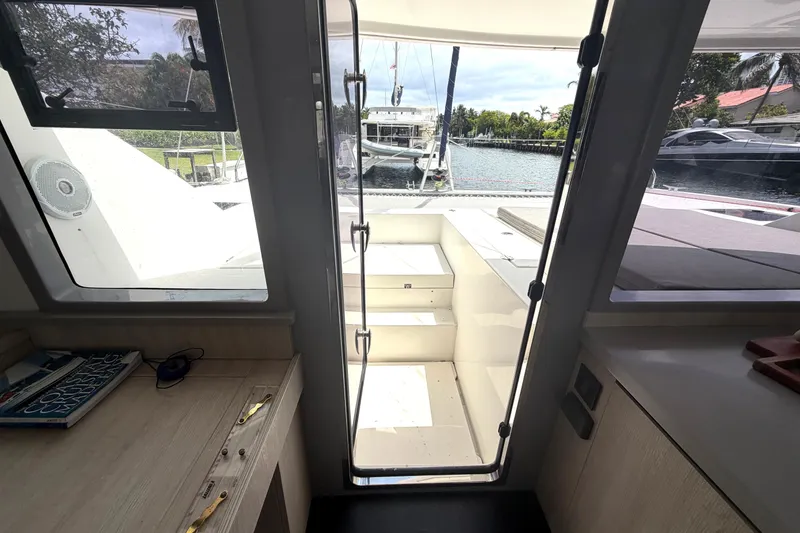 Slide: The Image of Interior view of a 2018 Leopard 40 catamaran, showing the doorway to the deck. - 57