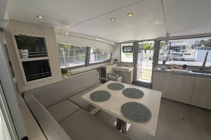 Slide: The Image of Modern interior of 2018 Leopard 40 catamaran with dining area and waterfront view. - 60