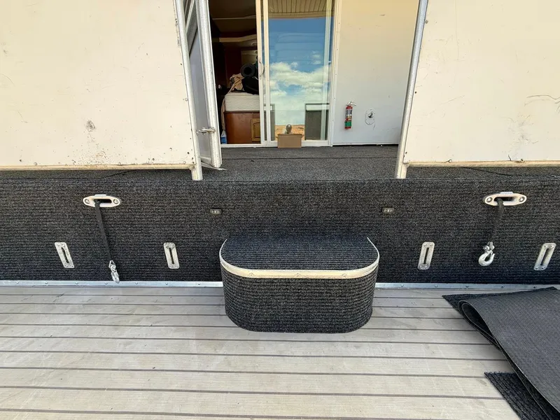 Slide: The Image of 2011 Bravada Dream Weaver Trip 14 boat deck with steps and sliding door. - 18