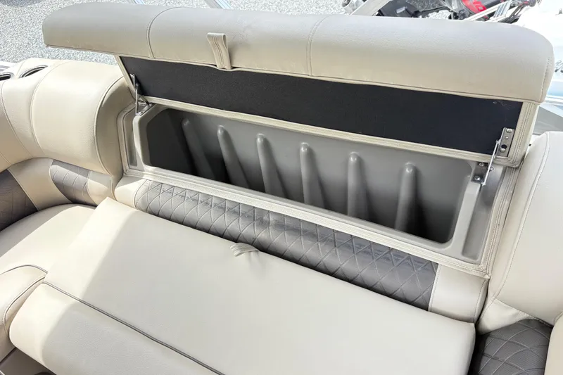 Slide: The Image of 2021 Sun Tracker Fishin' Barge 20 DLX storage compartment with cushioned seating. - 10