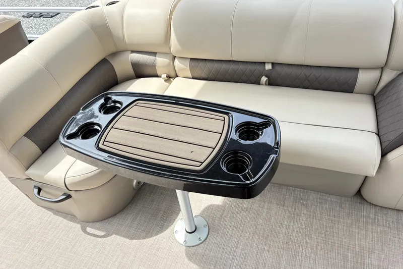 Slide: The Image of Luxurious seating and table on 2021 Sun Tracker Fishin' Barge 20 DLX pontoon boat. - 12