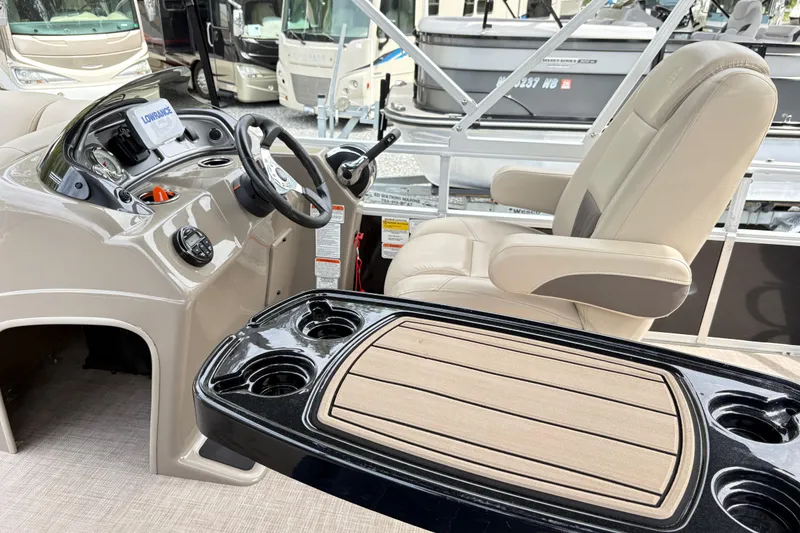 Slide: The Image of Interior view of 2021 Sun Tracker Fishin' Barge 20 DLX with steering console and seating. - 14
