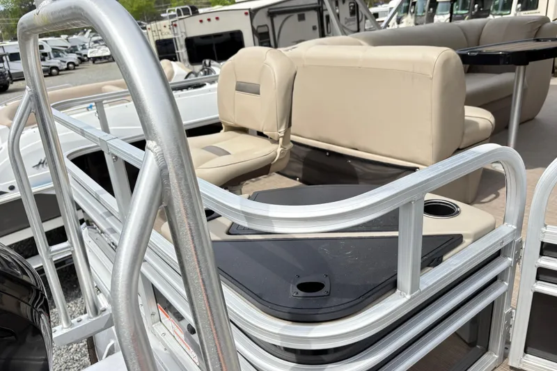 Slide: The Image of 2021 Sun Tracker Fishin' Barge 20 DLX with beige seating and aluminum railings. - 7