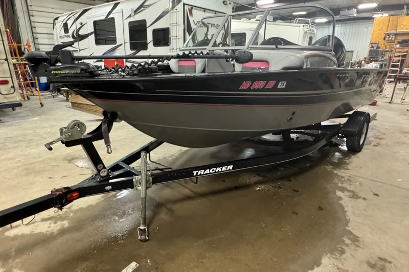 The Image of 2014 Tracker Targa V-18 WT boat on trailer in indoor storage facility. - 1