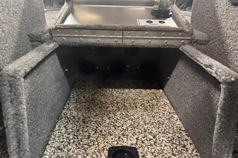Slide: The Image of Interior view of a 2014 Tracker Targa V-18 WT boat storage compartment. - 16