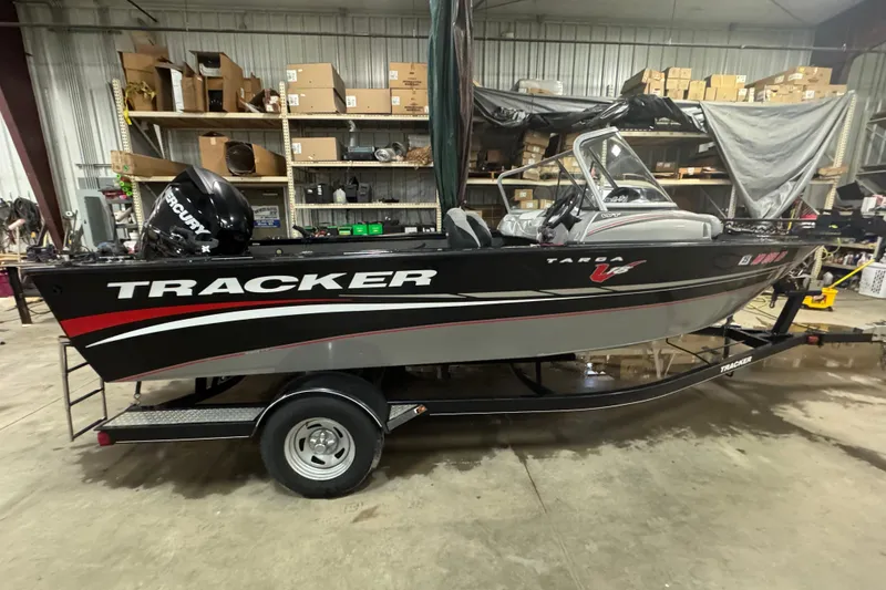 Slide: The Image of 2014 Tracker Targa V-18 WT boat in a warehouse setting. - 3