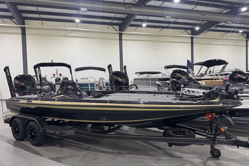 The Image of 2026 Skeeter ZXE21 bass boat in showroom, featuring sleek design and dual engines. - 0
