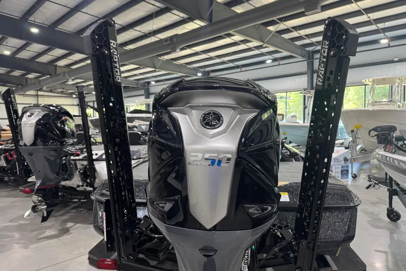 Slide: The Image of 2026 Skeeter ZXE21 boat with powerful outboard motor in showroom. - 12