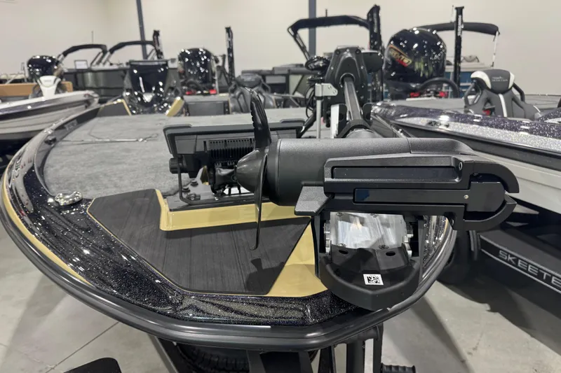 Slide: The Image of 2026 Skeeter ZXE21 boat with advanced trolling motor in showroom display. - 4