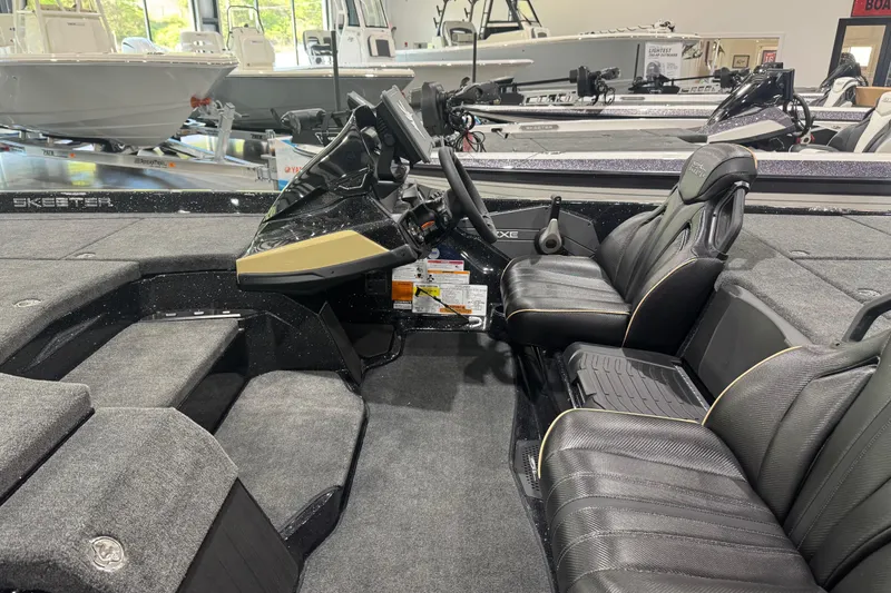 Slide: The Image of 2026 Skeeter ZXE21 boat interior with sleek black seating and modern dashboard. - 8