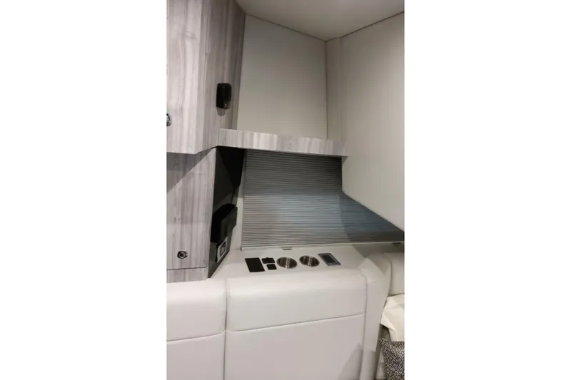 Slide: The Image of Interior of 2026 Formula 360 Crossover Bowrider I/O, featuring sleek cabinetry and modern design. - 14