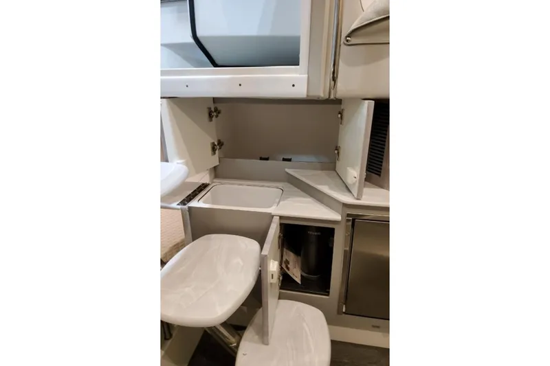 Slide: The Image of Interior of 2026 Formula 360 Crossover Bowrider I/O, featuring storage compartments and seating. - 16