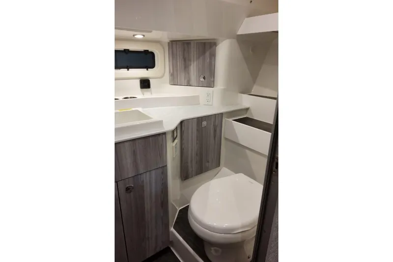Slide: The Image of 2026 Formula 360 Crossover Bowrider I/O bathroom with modern cabinetry and compact design. - 17