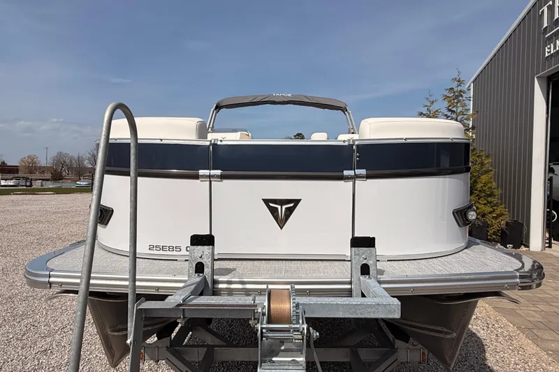 Slide: The Image of 2026 Tahoe Pontoon Cascade Quad Lounger 25' on trailer, parked outdoors. - 10