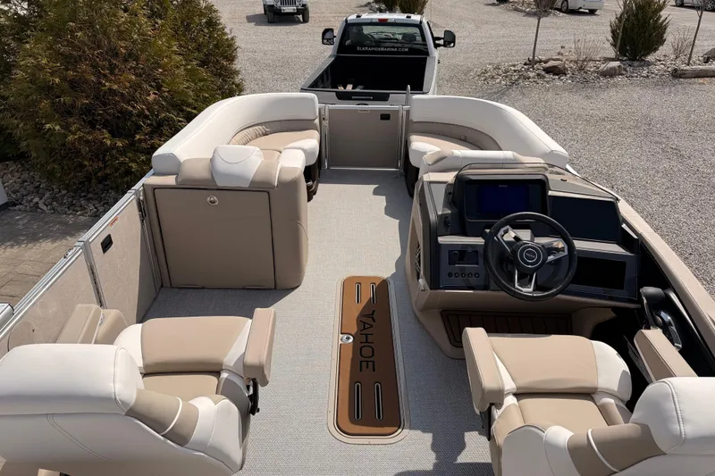 Slide: The Image of 2026 Tahoe Pontoon Cascade Quad Lounger, 25-foot luxury boat interior with plush seating and modern dashboard. - 15