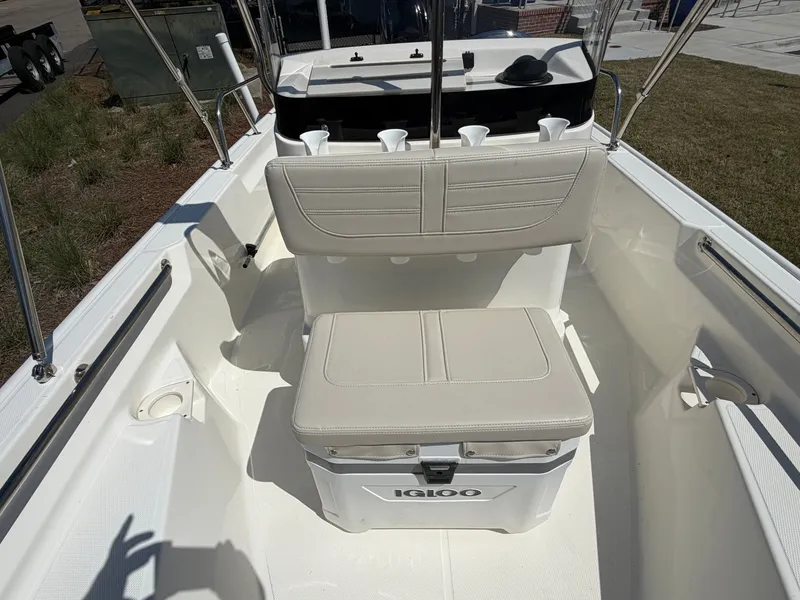 Slide: The Image of Interior of 2024 Boston Whaler 150 Montauk with bench seat and cooler. - 12