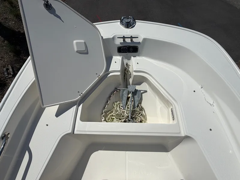 Slide: The Image of Anchor compartment of 2024 Boston Whaler 150 Montauk boat. - 14