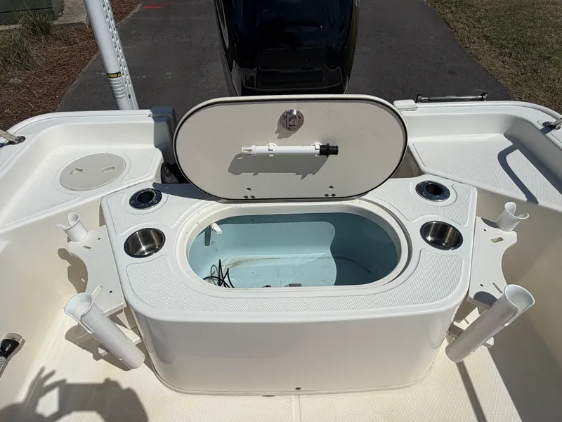 Slide: The Image of Boston Whaler 150 Montauk 2024 with open storage and cup holders. - 5