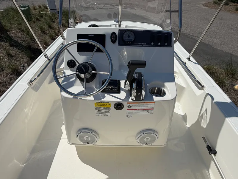 Slide: The Image of Interior view of 2024 Boston Whaler 150 Montauk helm. - 7