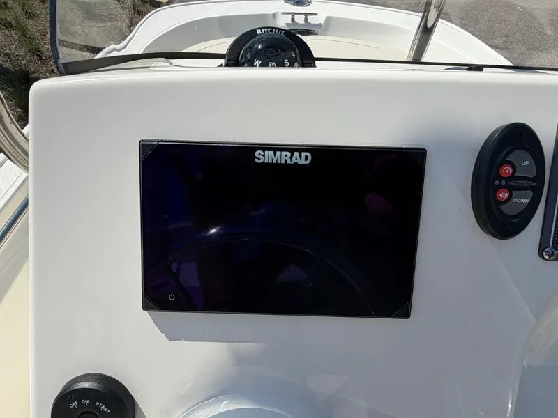 Slide: The Image of 2024 Boston Whaler 150 Montauk console with Simrad display. - 9