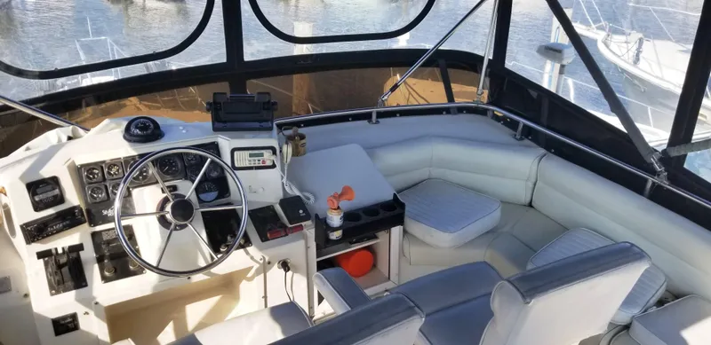 Slide: The Image of Interior of a 1989 Silverton 34 Convertible boat, helm and seating area. - 4