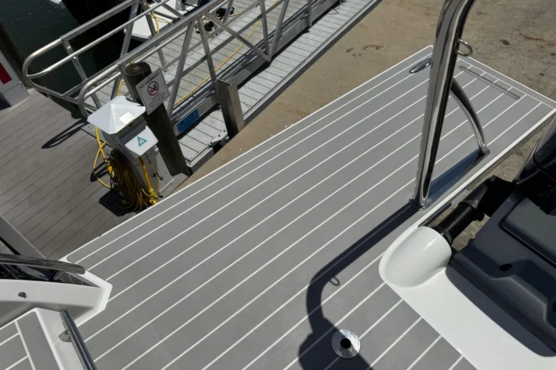 Slide: The Image of 2024 Formula 380 Super Sport Crossover OB boat deck at marina dock. - 10