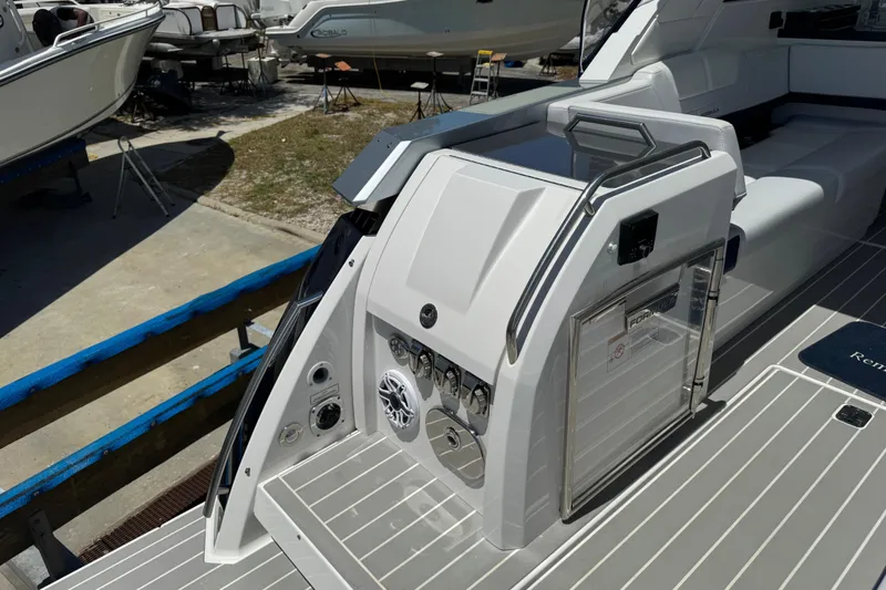 Slide: The Image of 2024 Formula 380 Super Sport Crossover OB boat deck with sleek design and modern features. - 12