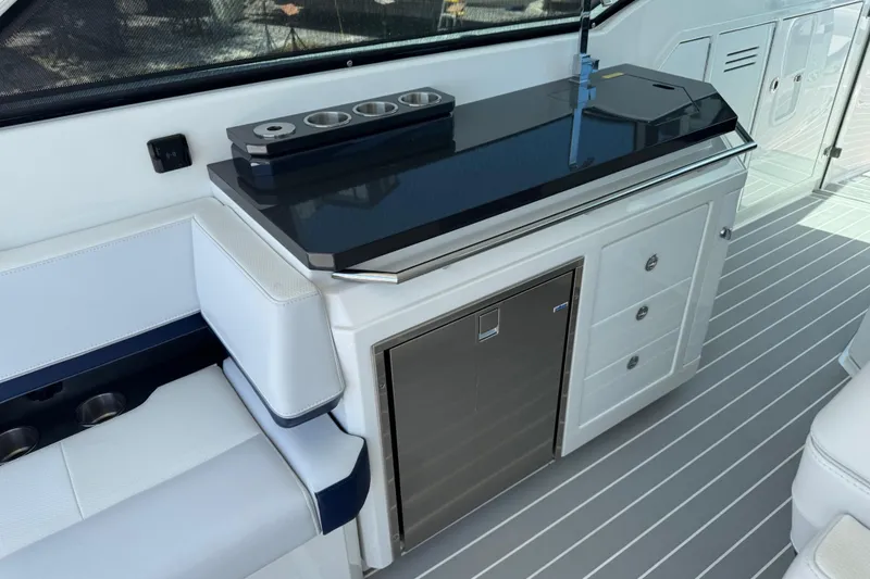 Slide: The Image of 2024 Formula 380 Super Sport Crossover OB interior with sleek cabinetry and seating. - 17