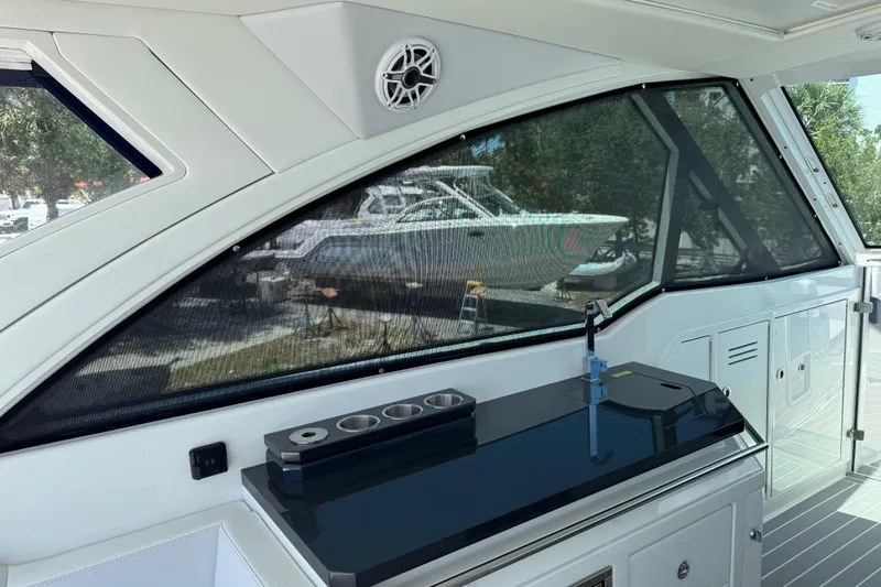 Slide: The Image of Interior view of 2024 Formula 380 Super Sport Crossover OB yacht with sleek design features. - 18