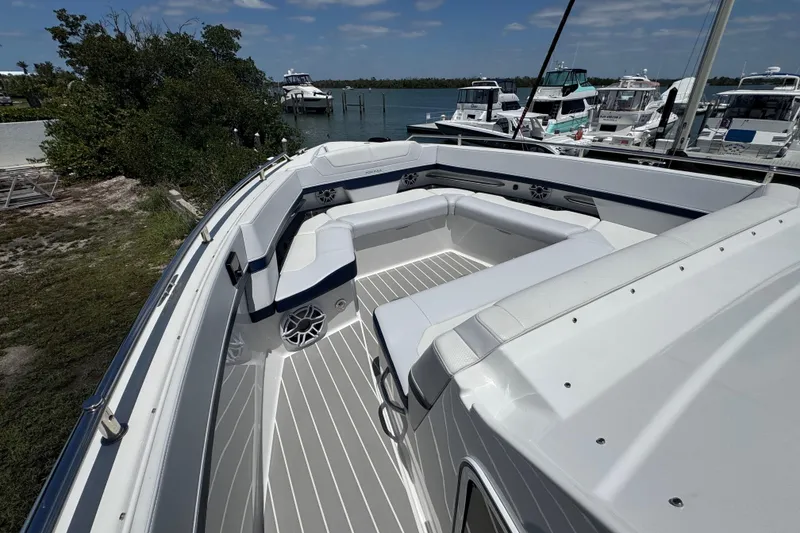 Slide: The Image of 2024 Formula 380 Super Sport Crossover OB boat with spacious seating and sleek design. - 24