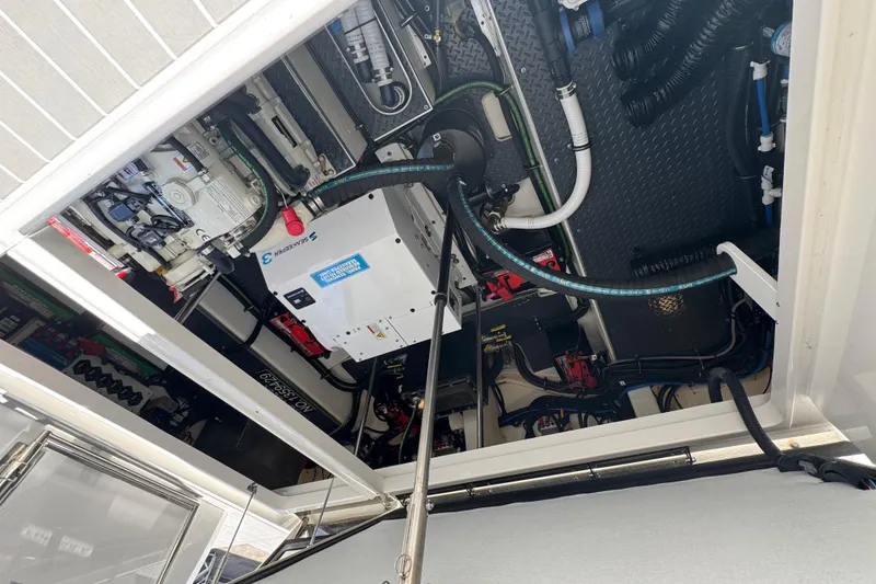 Slide: The Image of Engine compartment of 2024 Formula 380 Super Sport Crossover OB, showcasing complex wiring and components. - 36