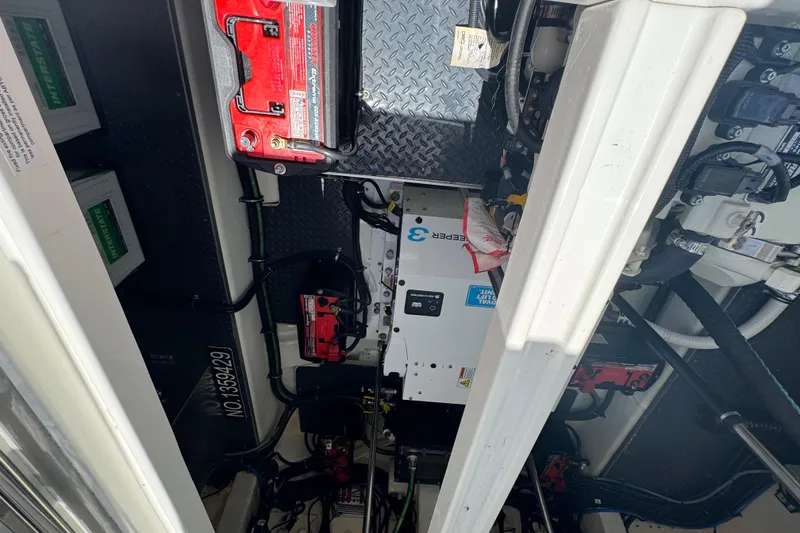 Slide: The Image of Engine compartment of 2024 Formula 380 Super Sport Crossover OB with batteries and wiring. - 37