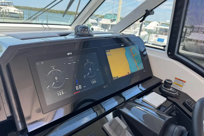 Slide: The Image of 2024 Formula 380 Super Sport Crossover OB dashboard with navigation and control screens. - 42