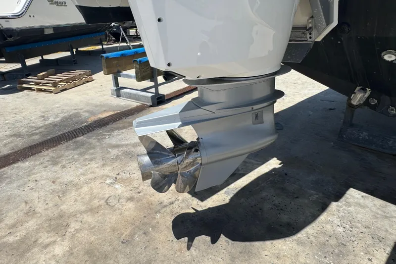 Slide: The Image of 2024 Formula 380 Super Sport Crossover OB outboard motor propeller on dry dock. - 5