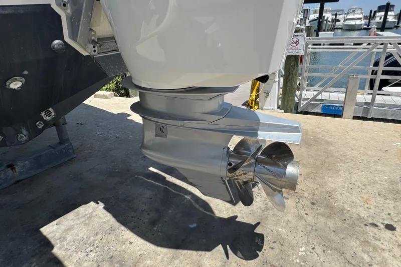 Slide: The Image of 2024 Formula 380 Super Sport Crossover OB outboard motor and propeller at marina. - 6