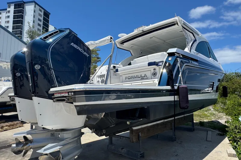 Slide: The Image of 2024 Formula 380 Super Sport Crossover OB boat with dual Mercury outboard engines. - 7