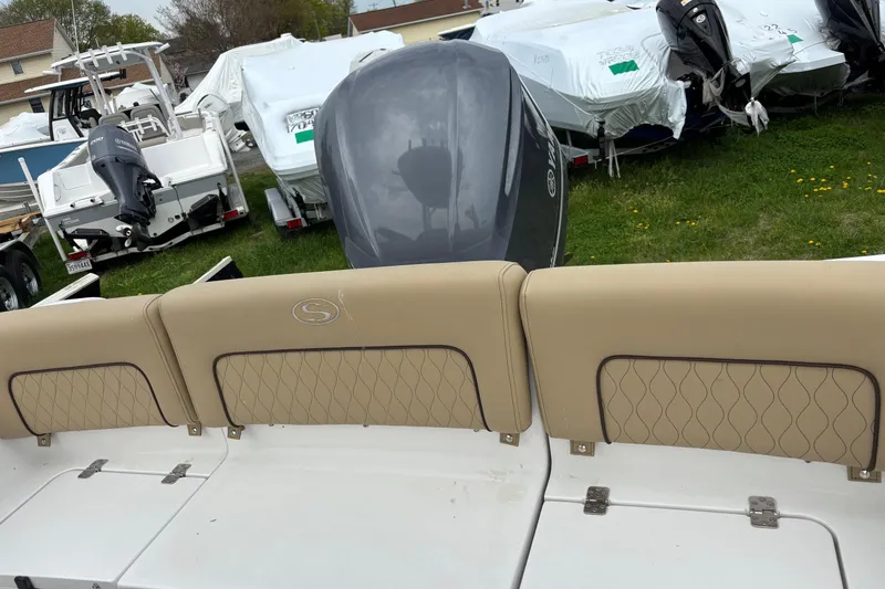 Slide: The Image of 2018 Sportsman Heritage 231 Center Console boat with beige seating and Yamaha outboard motor. - 4