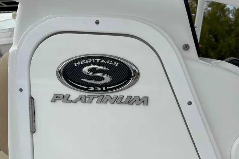 Slide: The Image of 2018 Sportsman Heritage 231 Center Console boat emblem and "Platinum" badge. - 8