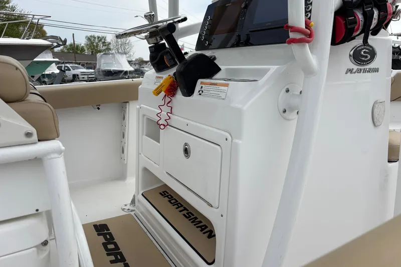 Slide: The Image of 2018 Sportsman Heritage 231 Center Console boat interior with steering and control panel. - 9