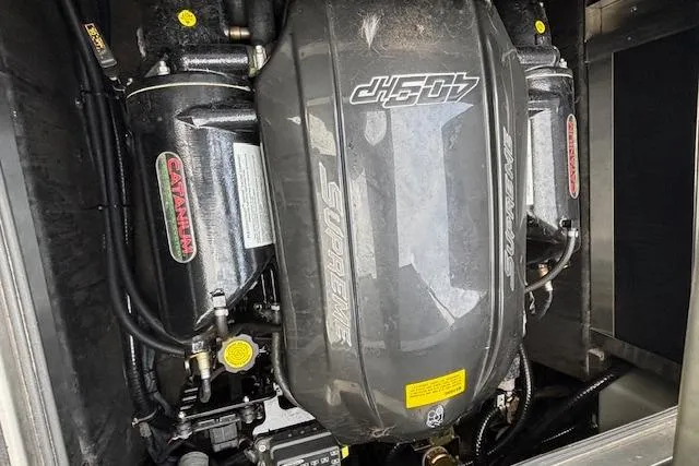 Slide: The Image of Engine of 2019 Supreme ZS232 boat, featuring a 409 HP motor. - 15