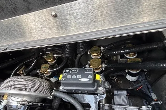 Slide: The Image of Engine components of a 2019 Supreme ZS232 boat, showcasing intricate wiring and mechanical parts. - 16