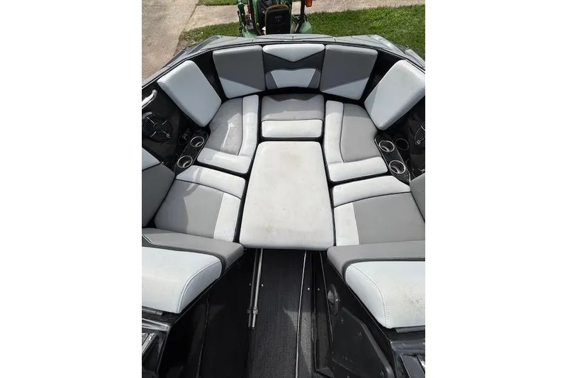 Slide: The Image of 2019 Supreme ZS232 boat interior with gray and white cushioned seating. - 18