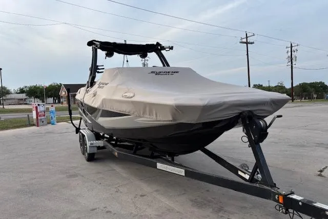 Slide: The Image of 2019 Supreme ZS232 boat on trailer with cover in parking lot. - 3