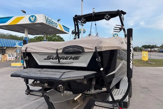 Slide: The Image of 2019 Supreme ZS232 boat at Valero gas station, rear view. - 4