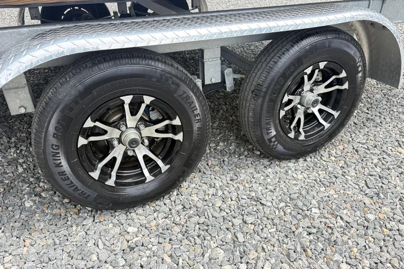 Slide: The Image of 2023 SunCatcher X322 RC trailer wheels on gravel surface. - 10