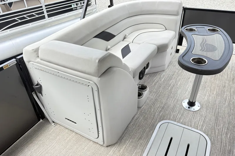 Slide: The Image of 2023 SunCatcher X322 RC boat interior with plush seating and a stylish table. - 11
